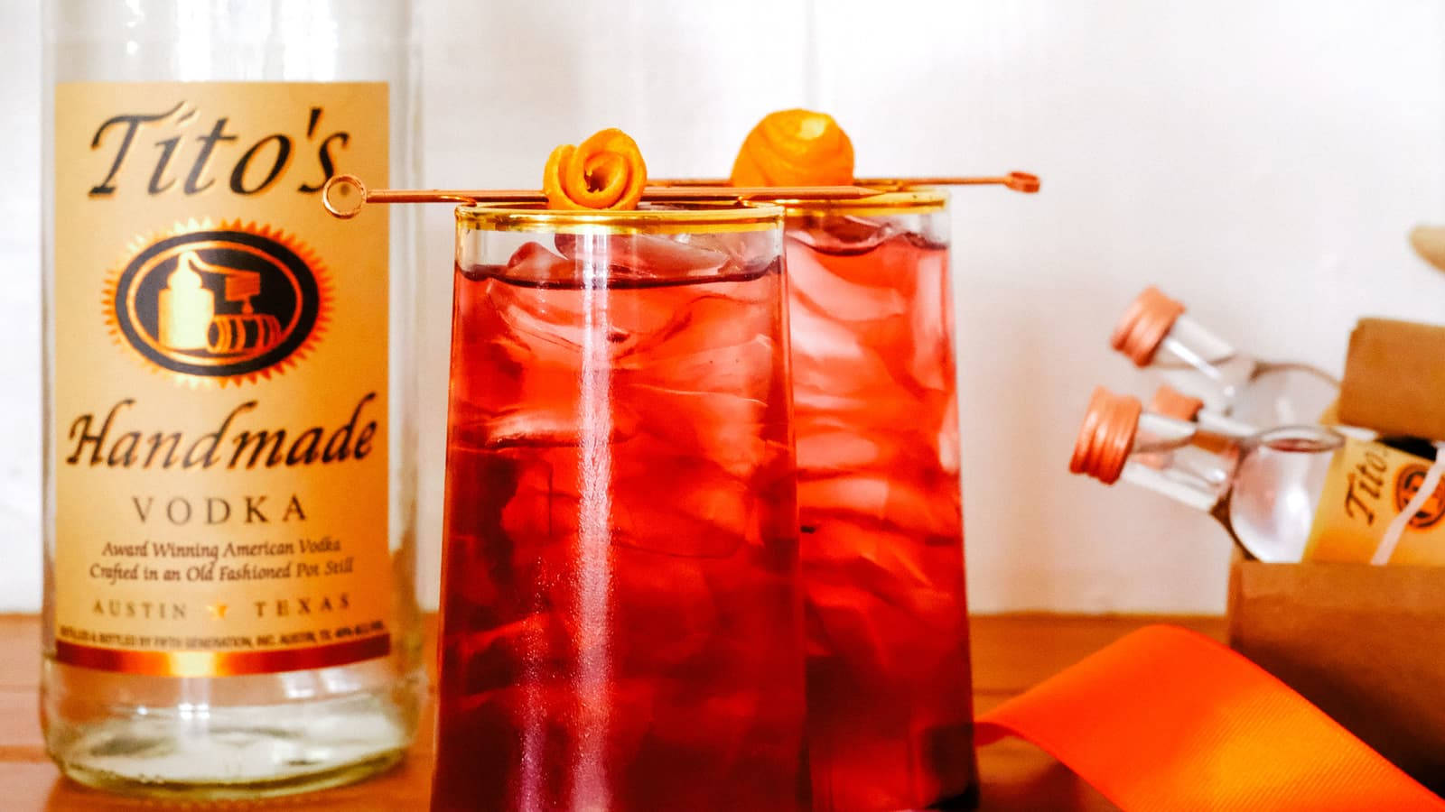 Toasting The Evening With Tito's Cranberry Cocktail Background