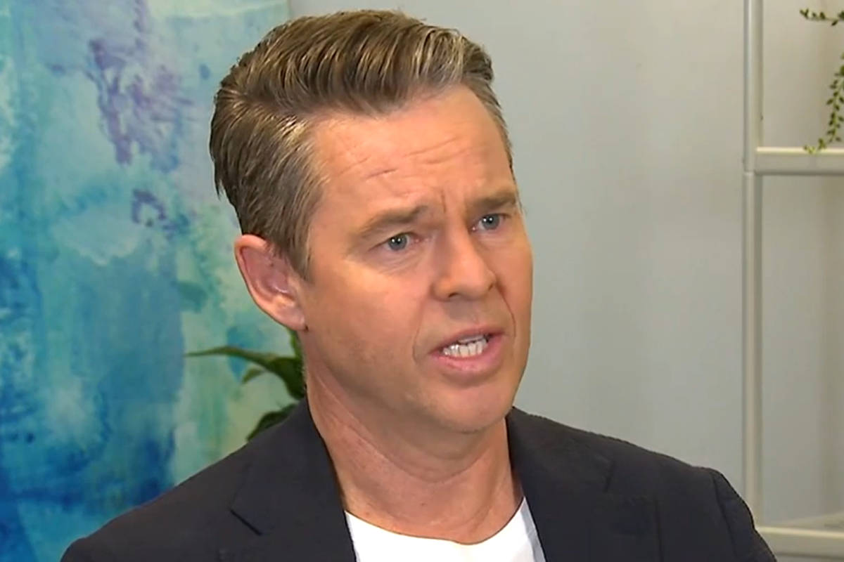 Todd Woodbridge Engaging In An Interview Background