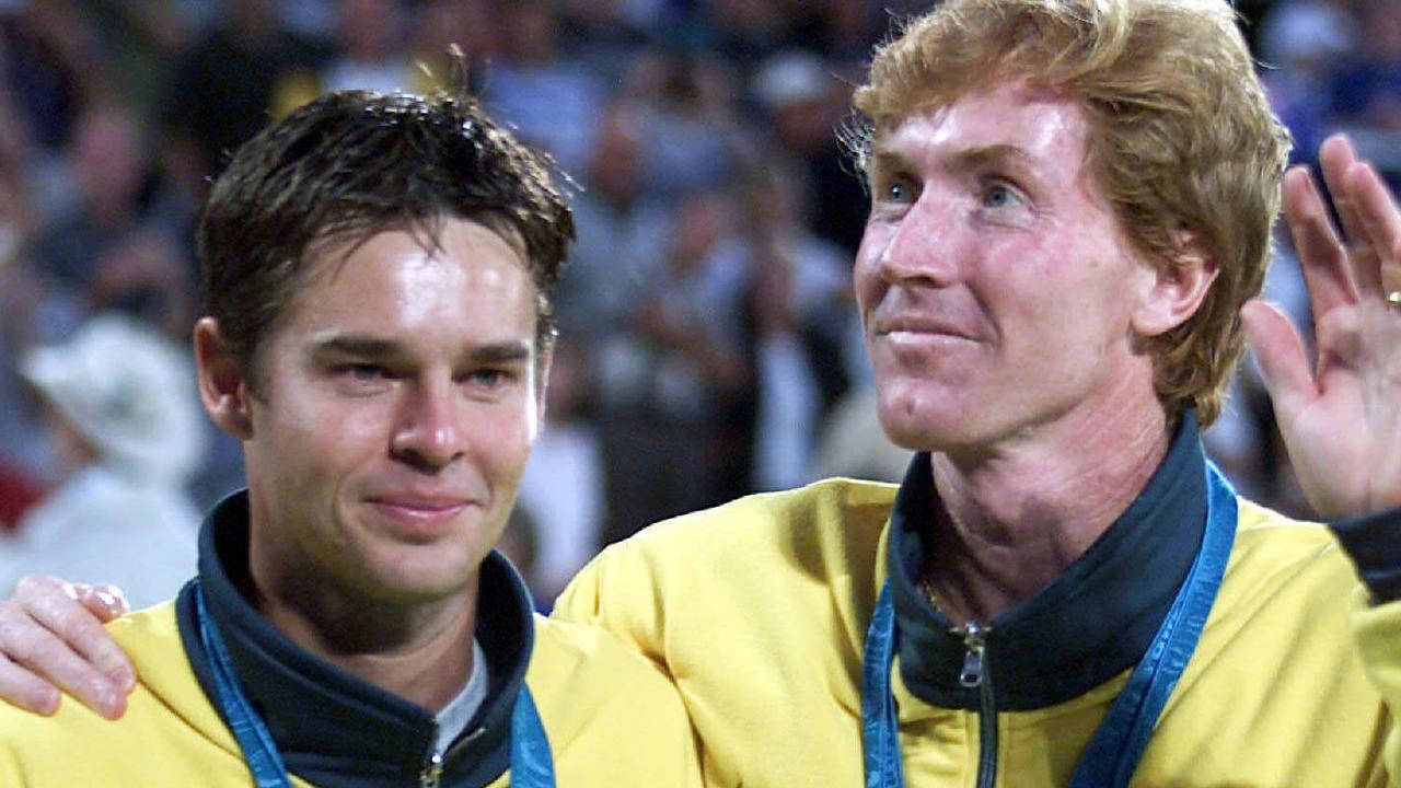 Todd Woodbridge Holding The Winning Trophy Of Team Australia Background