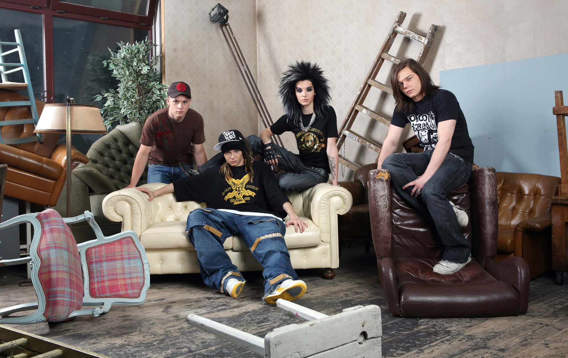 Tokio Hotel Band Membersin Disheveled Room Background