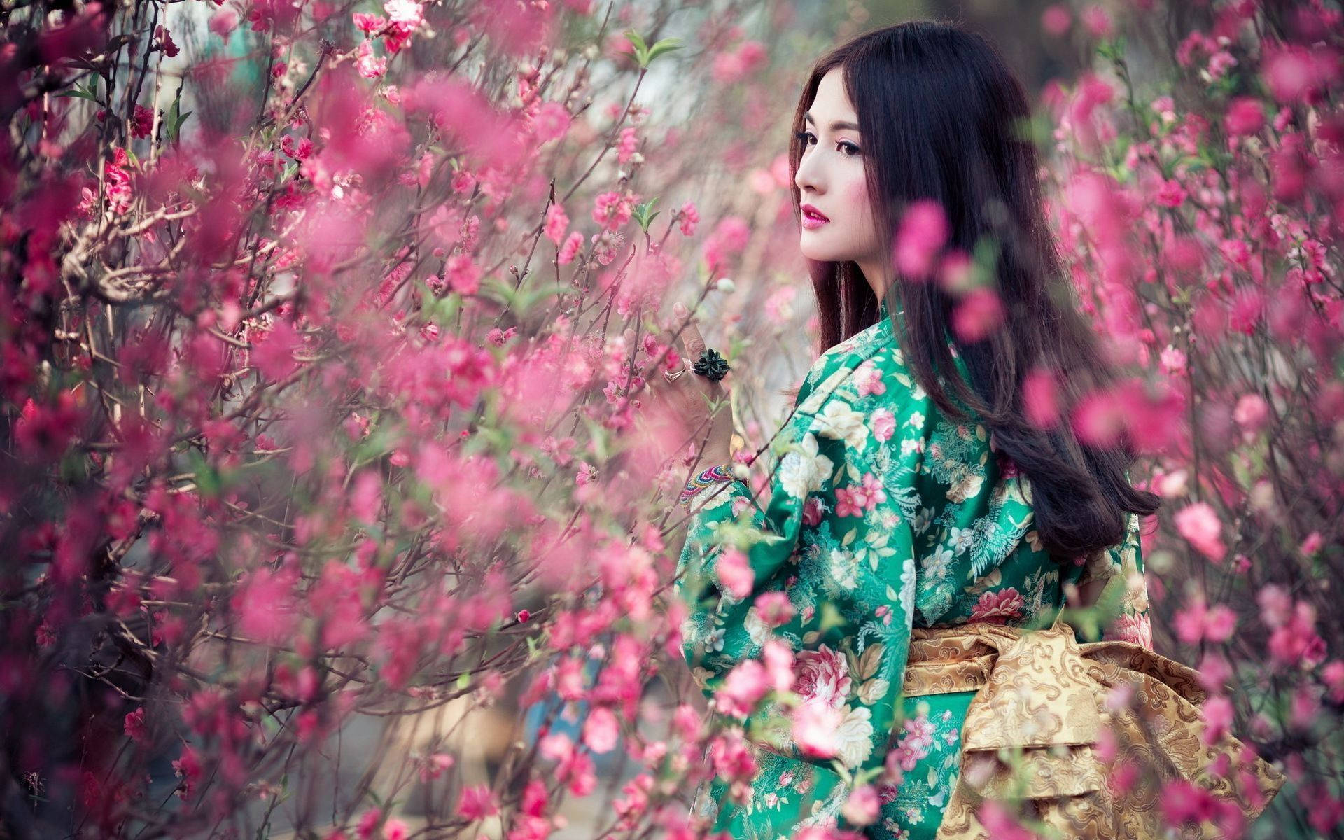 Tokyo Japan Girl Among Pink Flowers Background