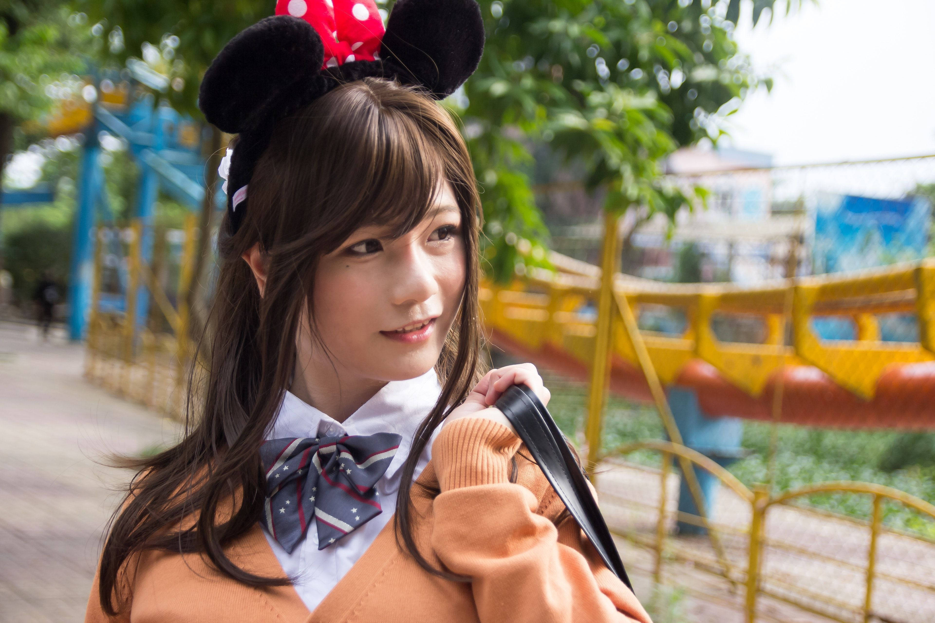 Tokyo Japan Girl With Minnie Mouse Headband Background