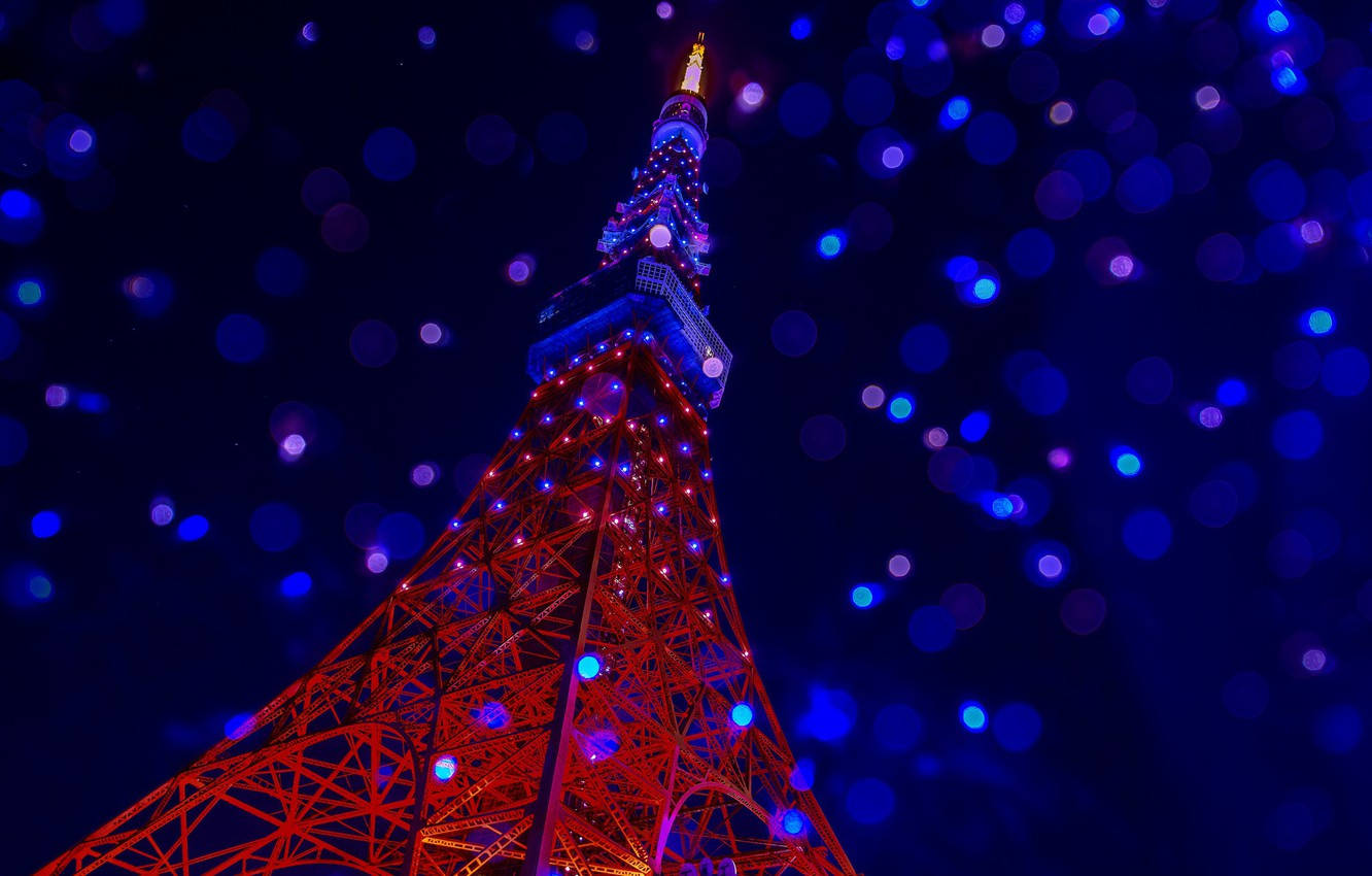 Tokyo Tower Photographed With Defocused Lights Background