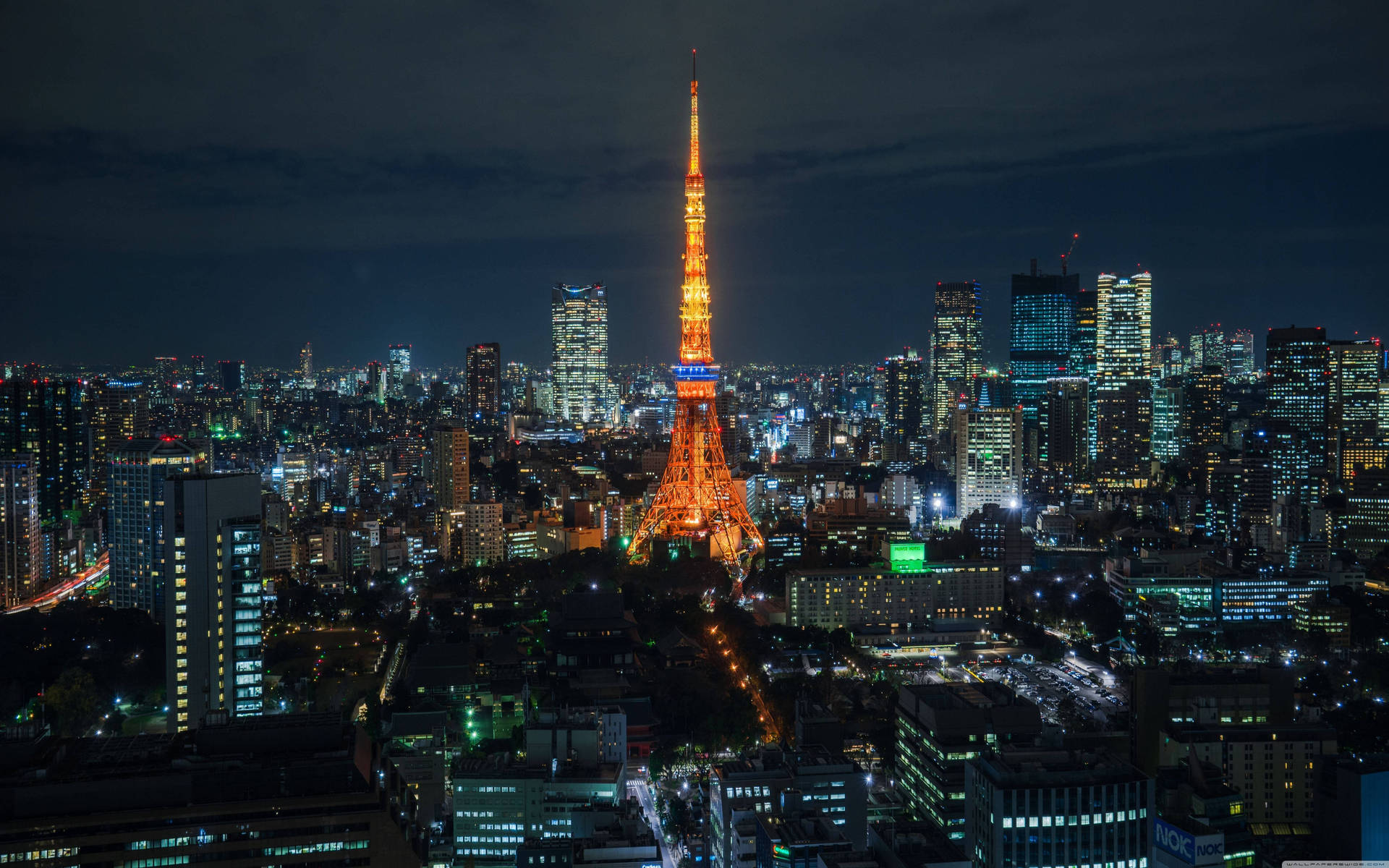 'tokyo Tower Standing Tall Amidst The Dazzling Tokyo Skyline'