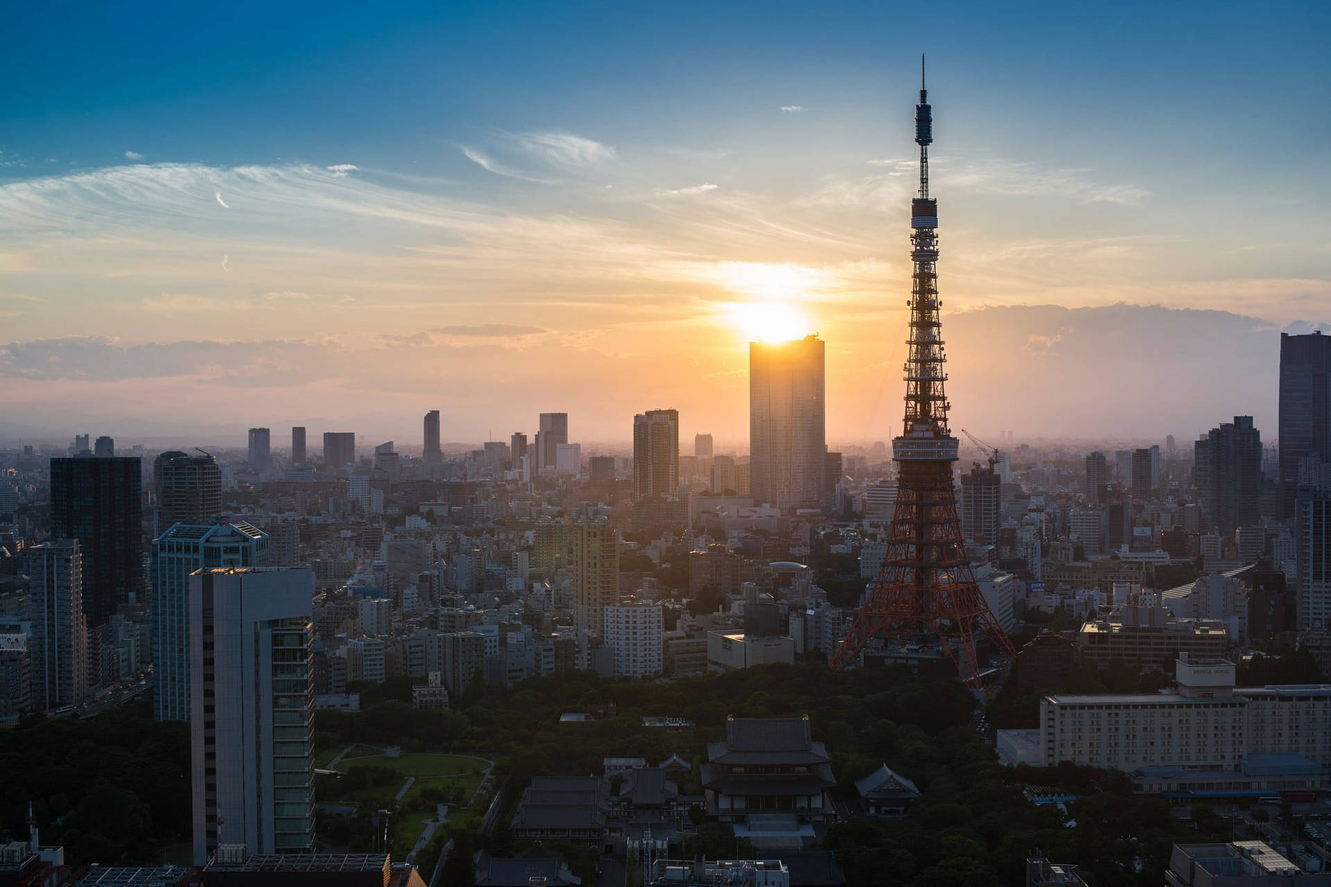 Tokyo Tower Sun Peeking Through Clouds Background