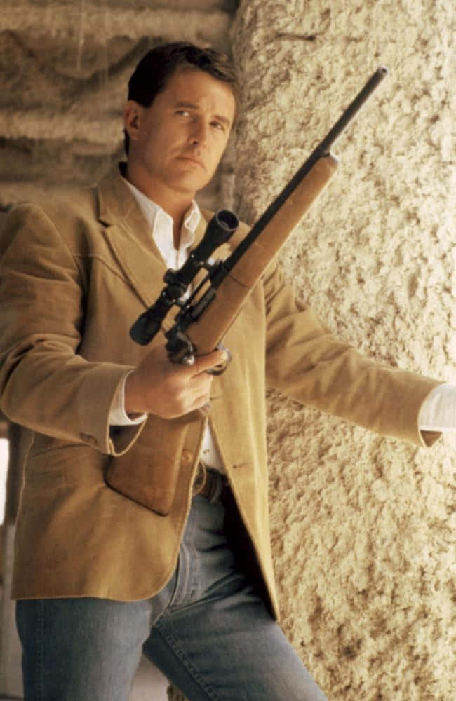 Tom Berenger, Award-winning Actor In A Charismatic Pose. Background