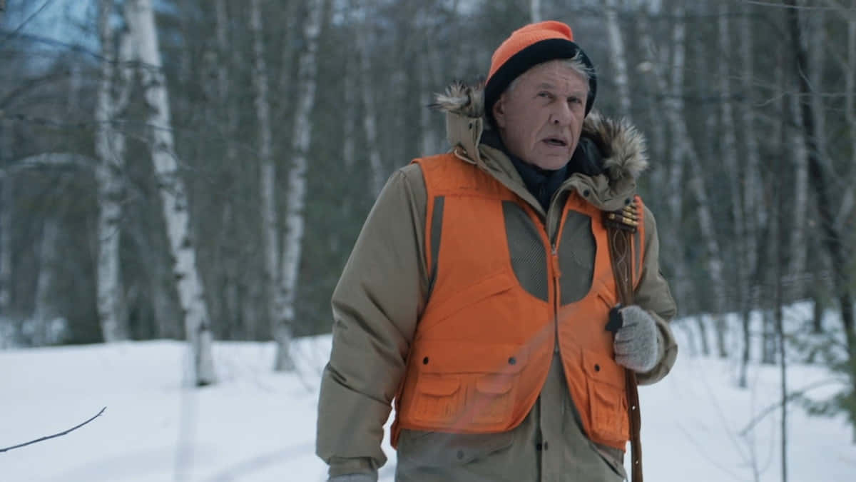 Tom Berenger Giving An Intense Look In A Movie Scene Background