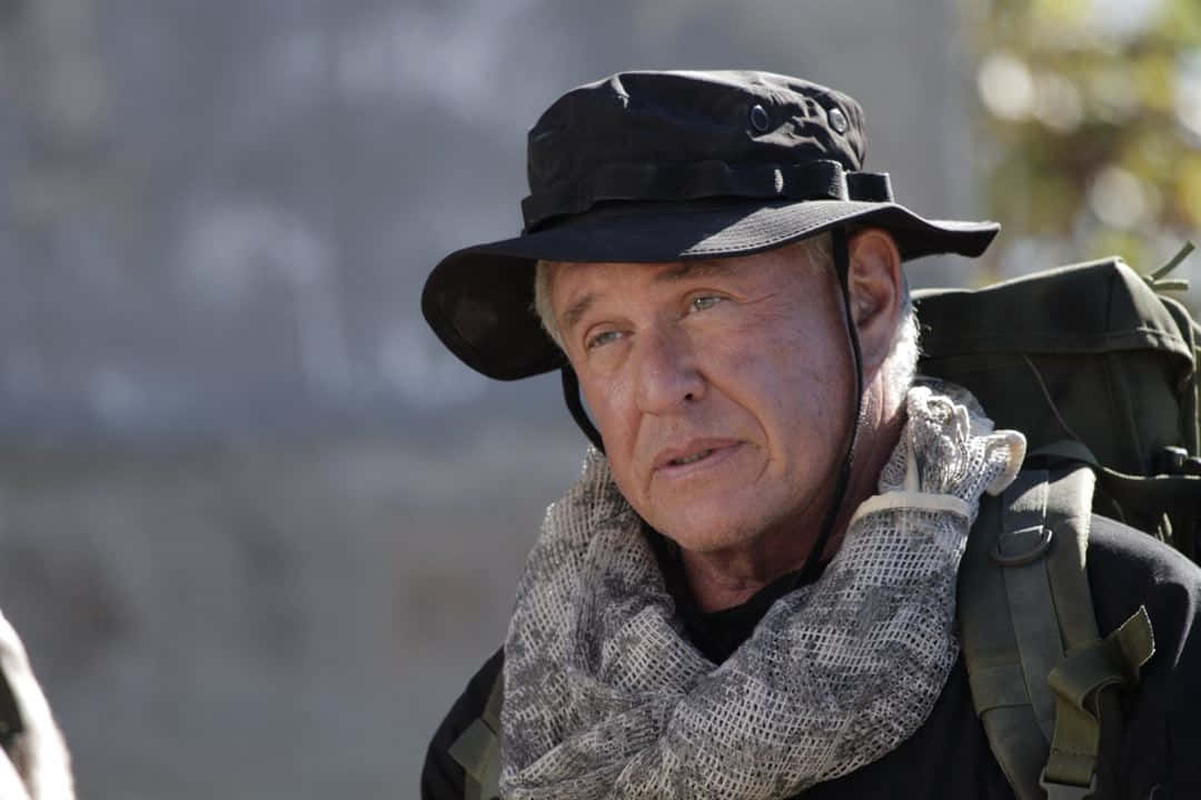 Tom Berenger, Legendary Actor, Posing For An Intense Portrait Background