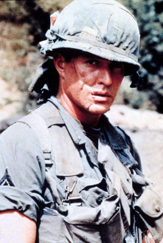 Tom Berenger Smoldering In Denim Background