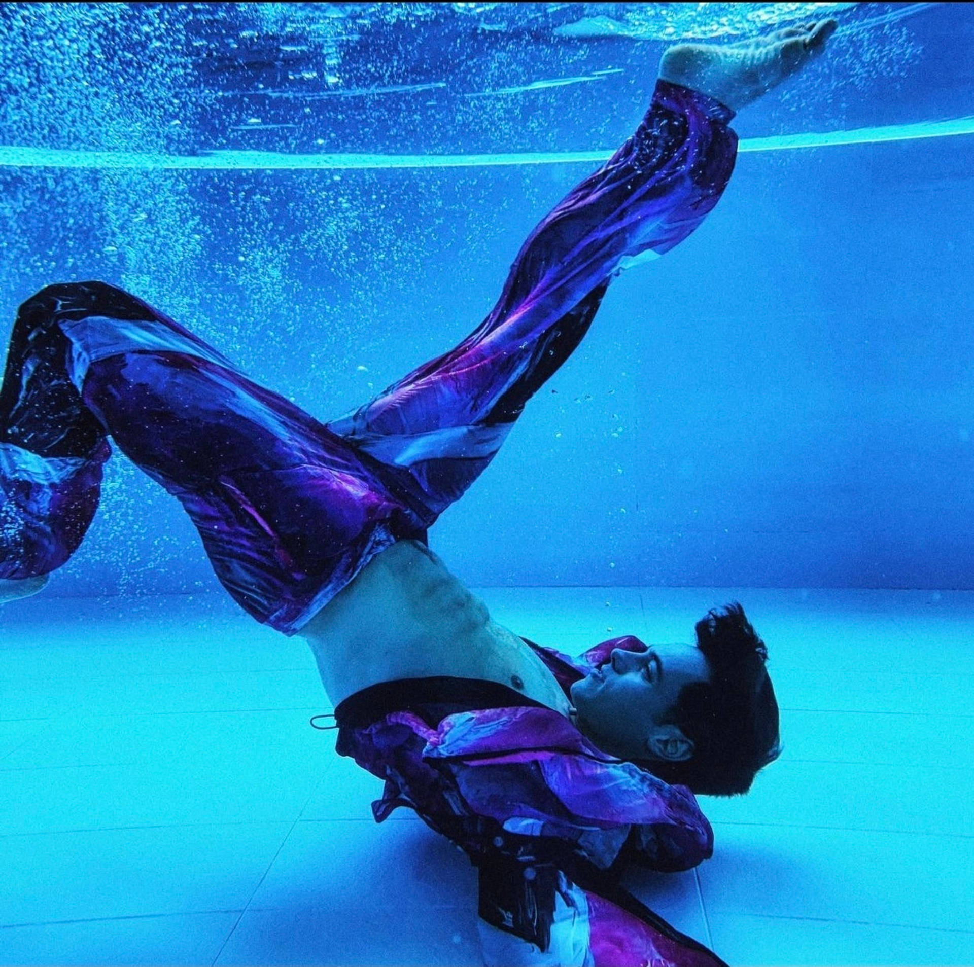 Tom Daley In Blue Pool Background