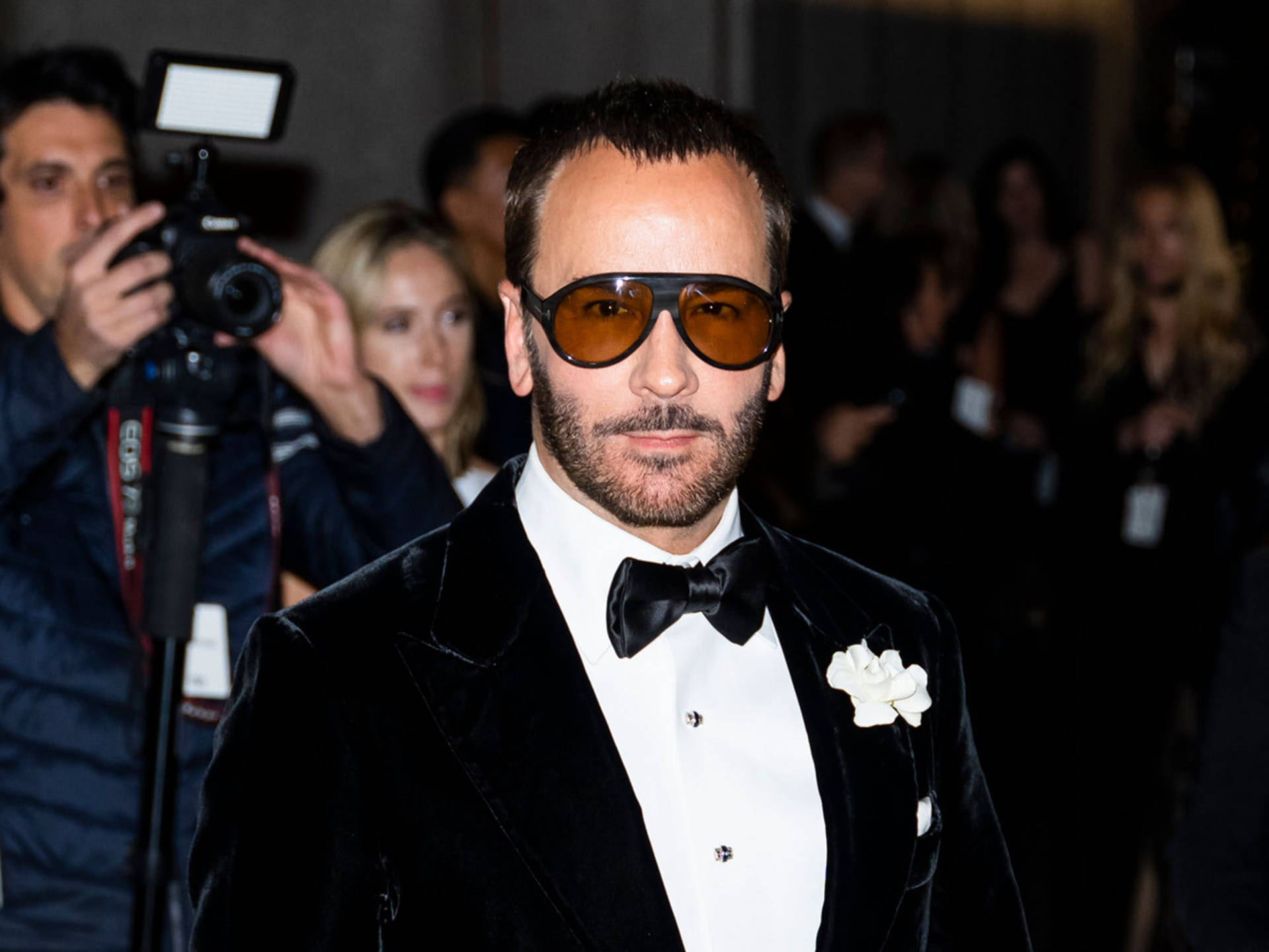 Tom Ford With Shades And Flowers Background