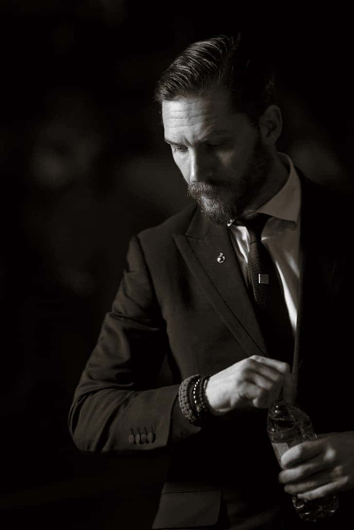 Tom Hardy In A Classic Men Suit Style Background