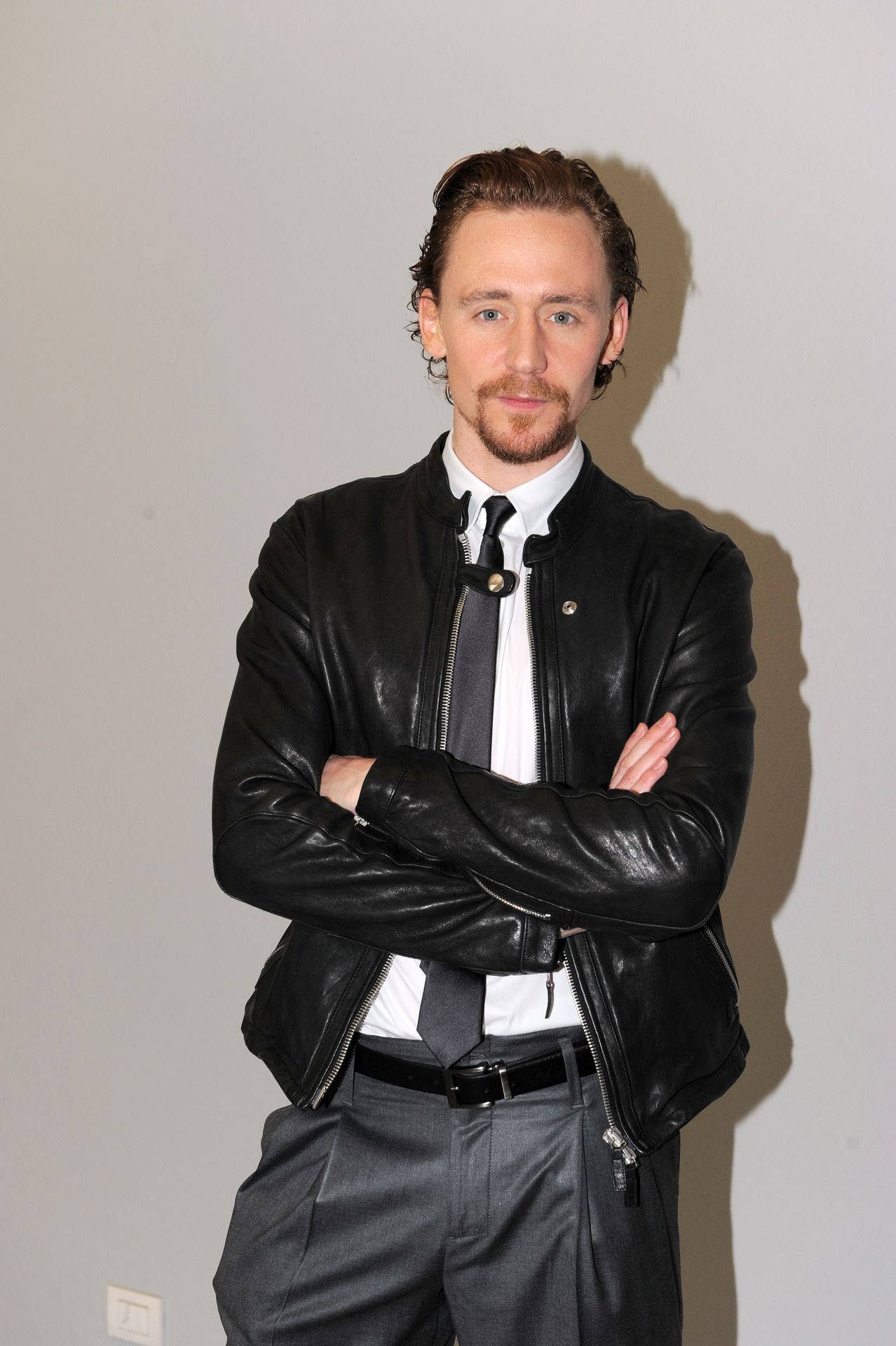 Tom Hiddleston At Emporio Armani Show Background