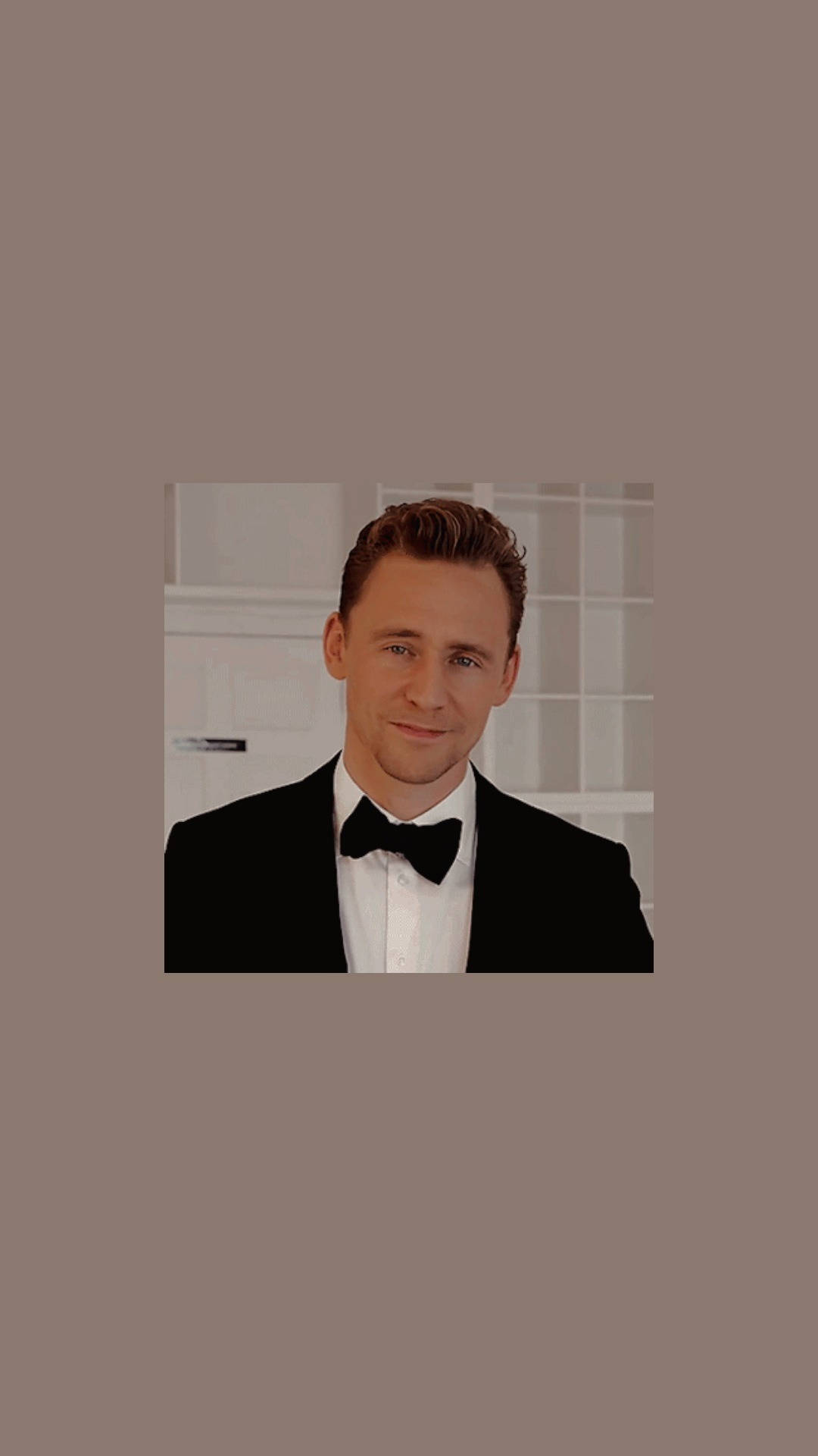 Tom Hiddleston In A Bow Tie Background