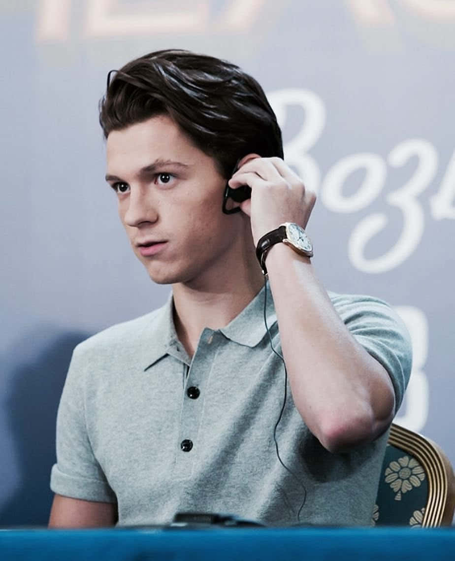 Tom Holland Debonair And Stylish Background