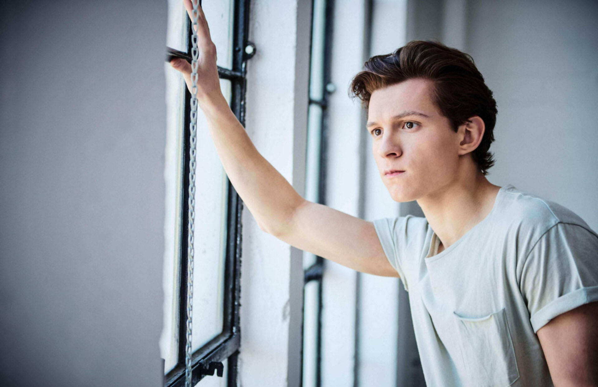 Tom Holland In Gray Shirt Background