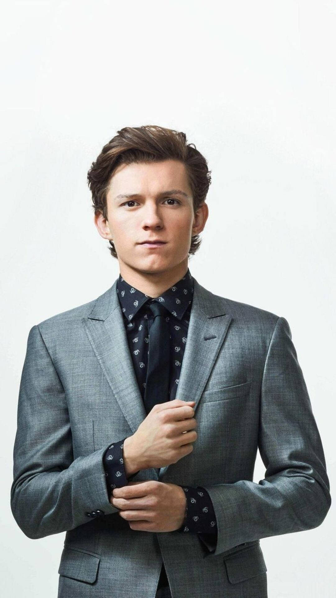 Tom Holland In Gray Suit Background