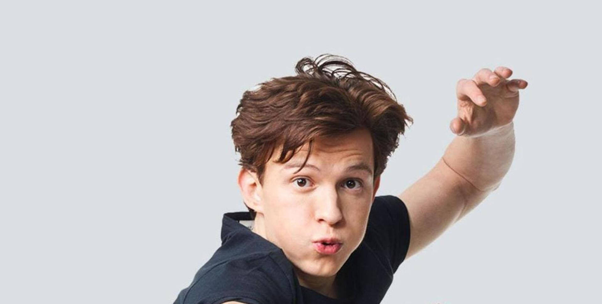 Tom Holland Striking A Casual Pose Background