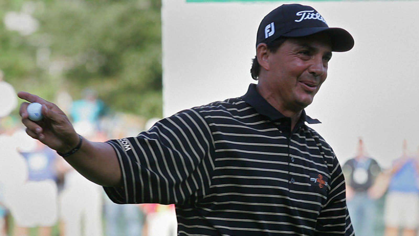 Tom Pernice Jr Holding Out Ball Background