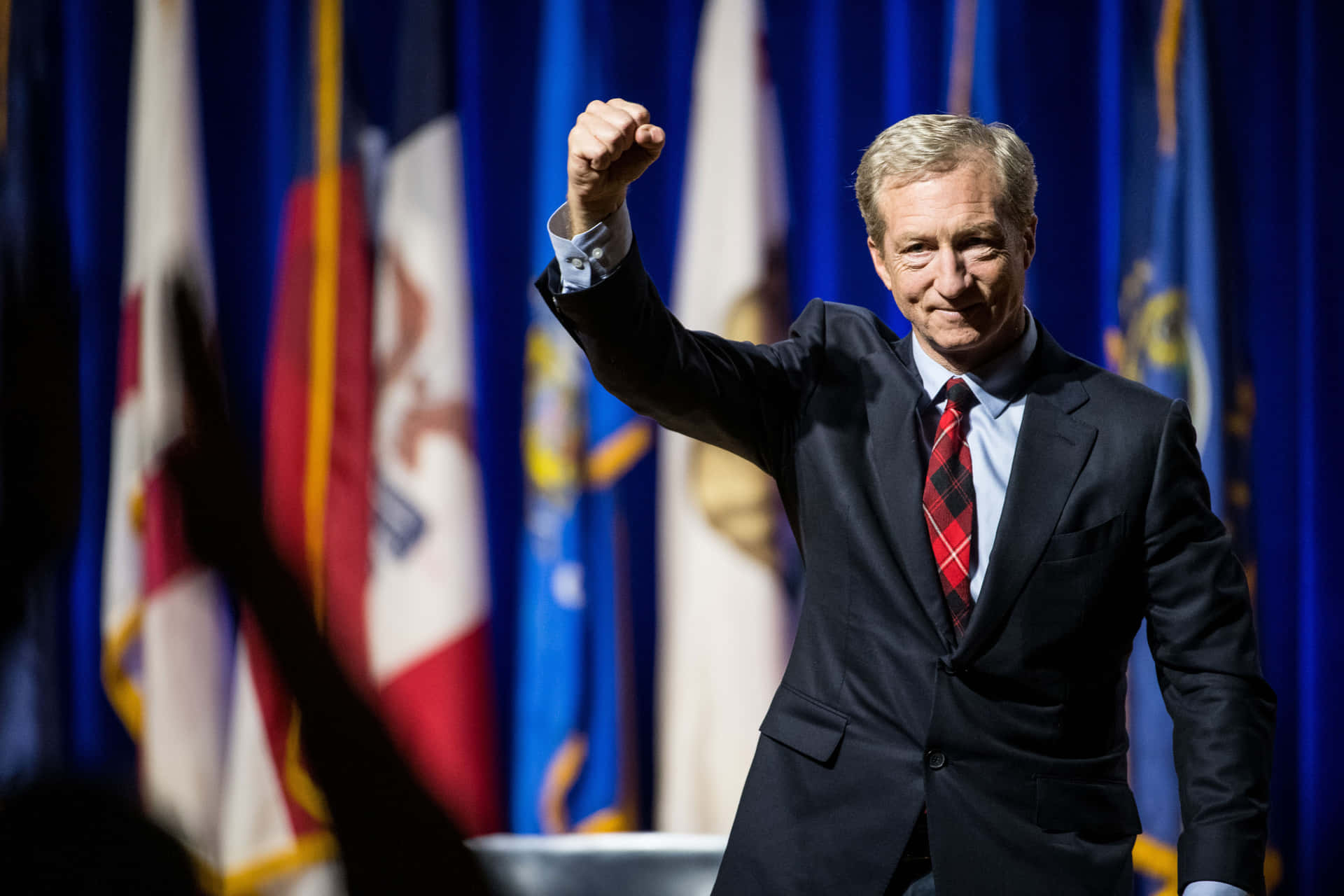 Tom Steyer Hand Fist Background