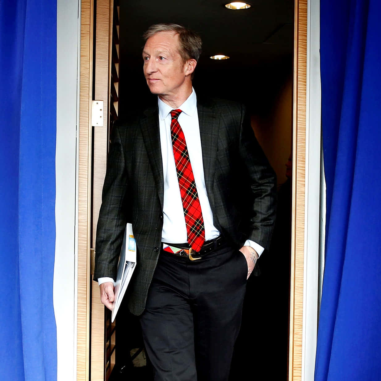 Tom Steyer Standing Against The Door