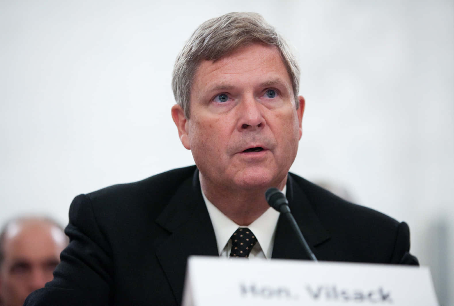 Tom Vilsack With Blurry White Background Background