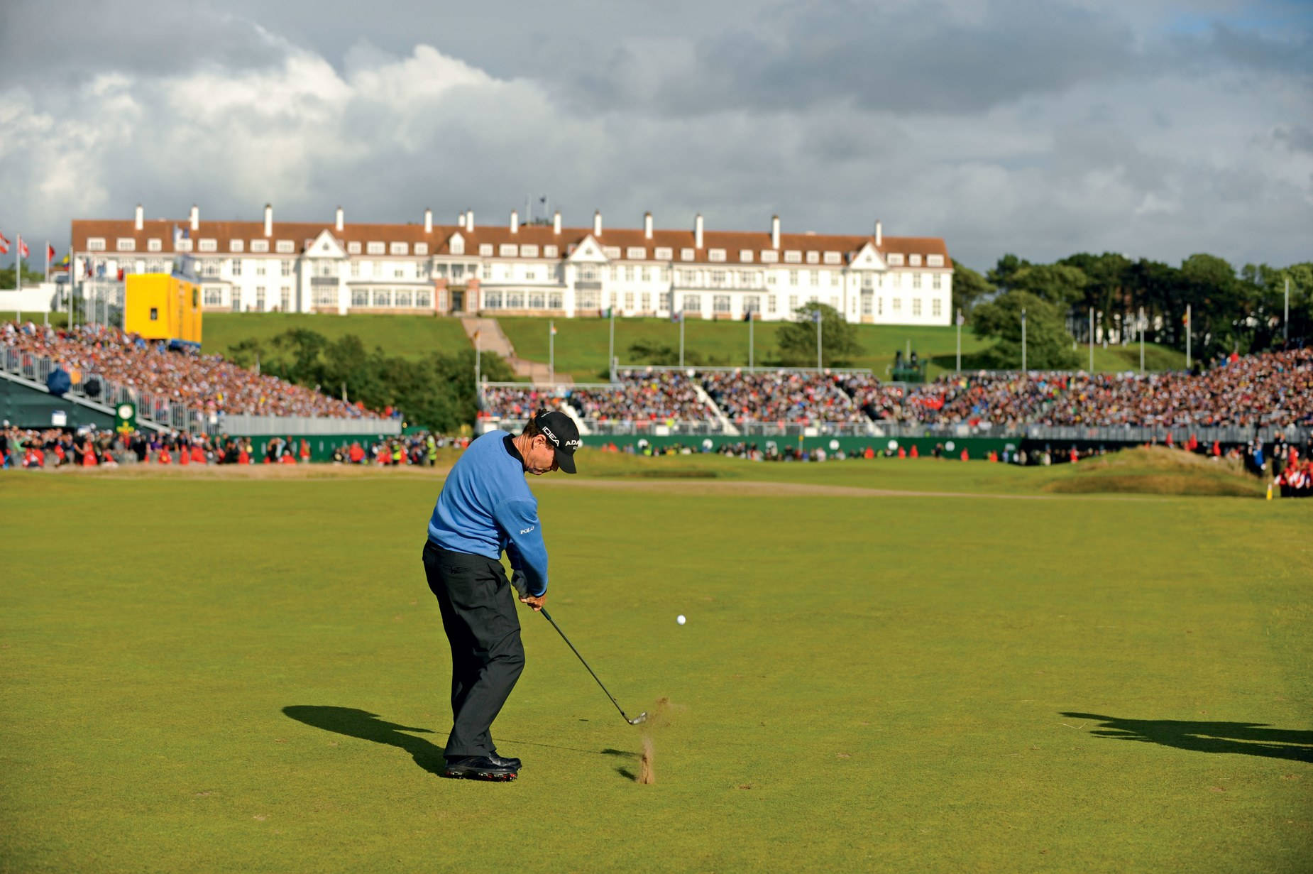 Tom Watson Hitting A Golf Shot Background