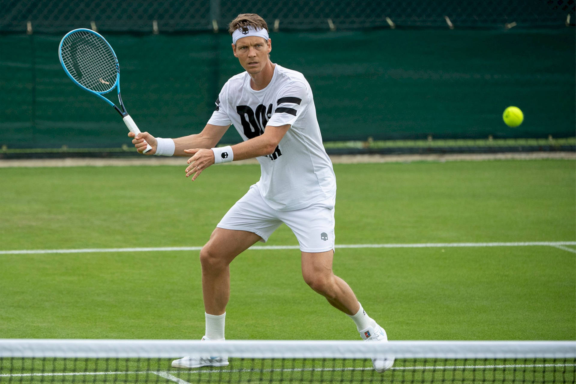 Tomas Berdych About To Hit Ball Background