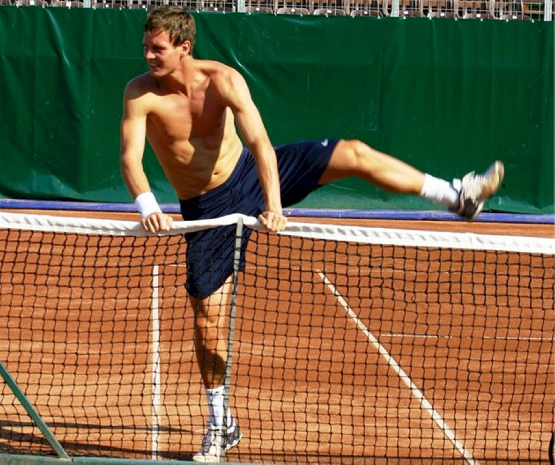 Tomas Berdych Masterful Mid-game Net-crossing Moment Background