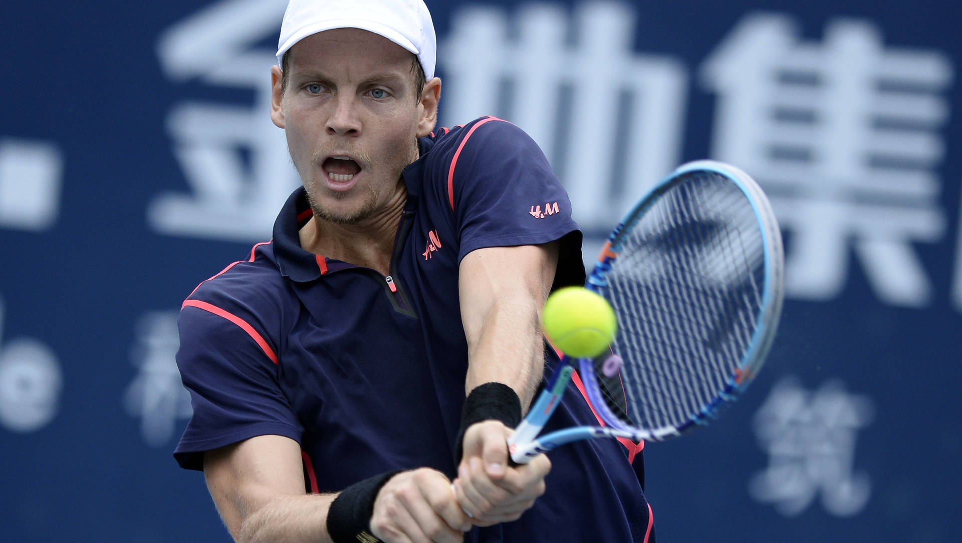 Tomas Berdych Swinging To Hit The Ball Background