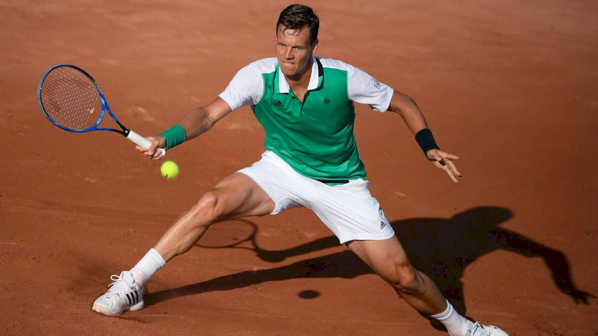 Tomas Berdych Trying To Hit Ball Background