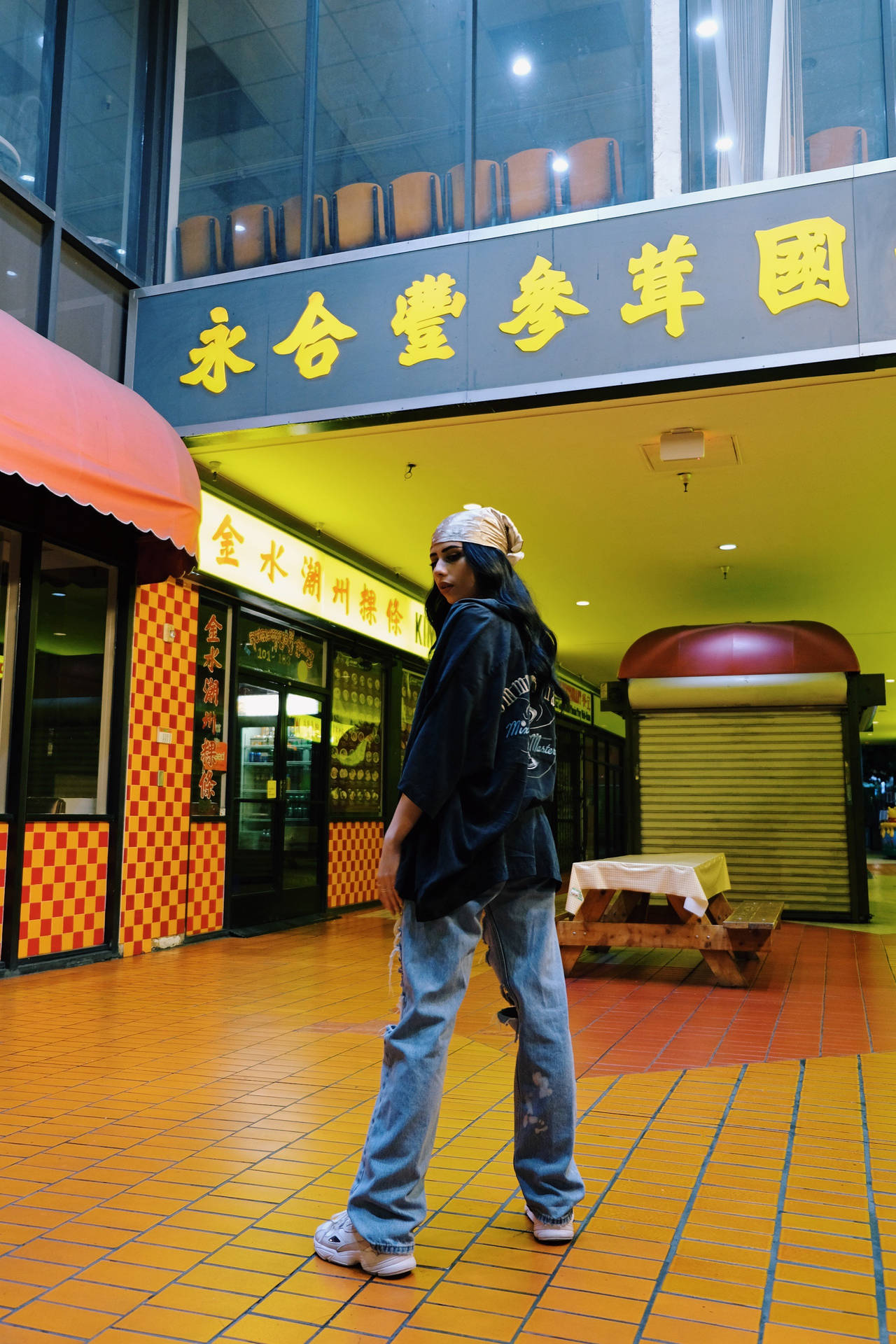 Tomboy In A Chinese Mall Background