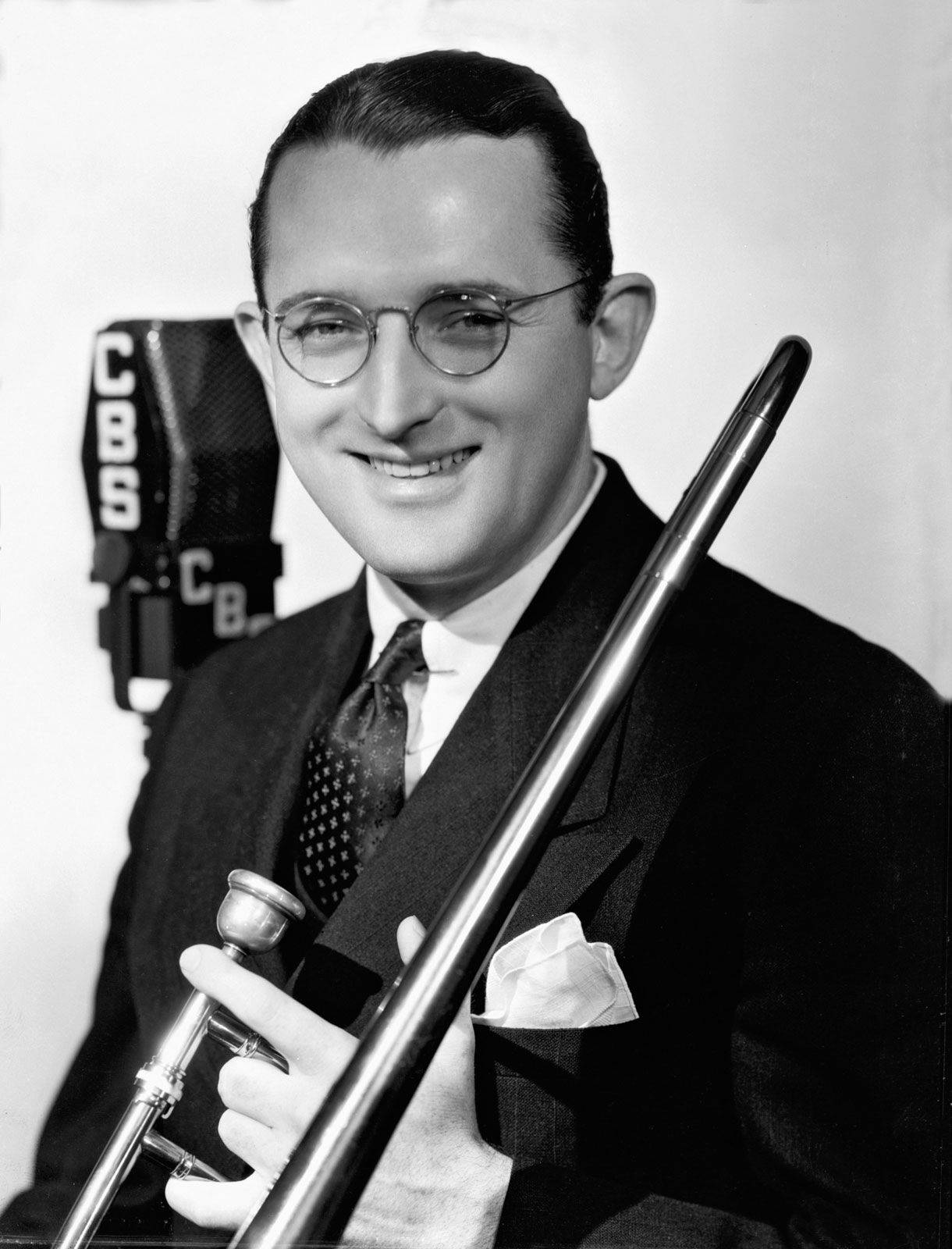 Tommy Dorsey's Engaging Smile In A Black And White Portrait