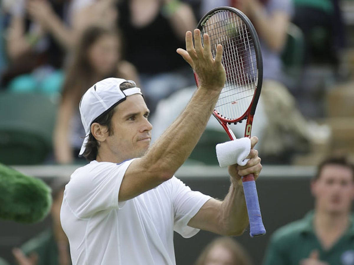 Tommy Haas Clapping On Racket Background