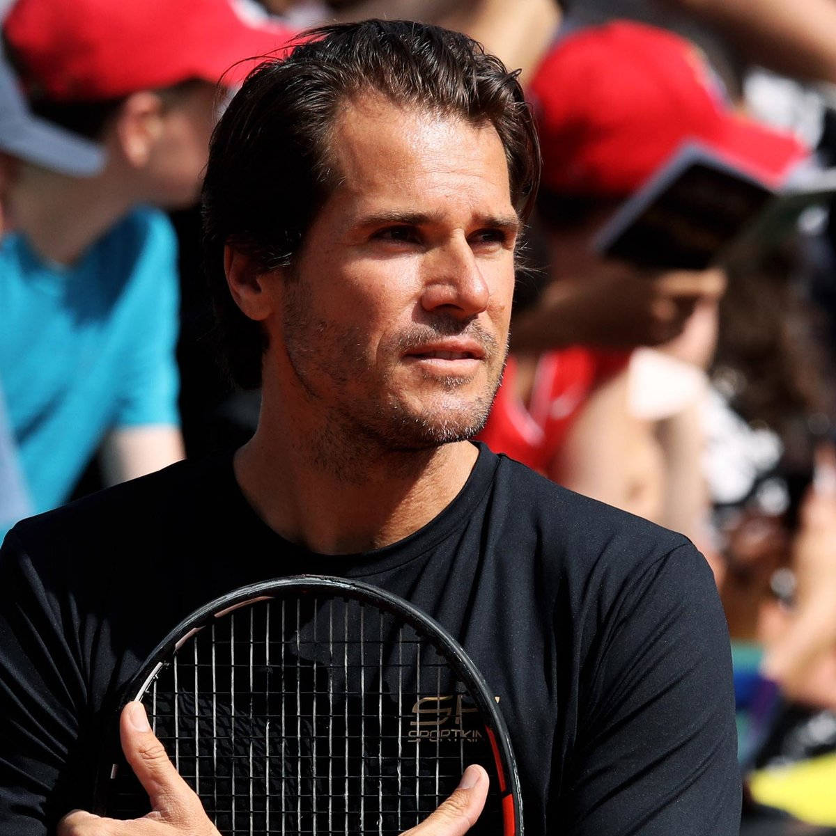 Tommy Haas Clutching Racket Background