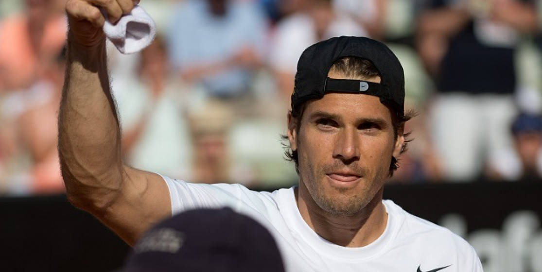 Tommy Haas Holding Up Cloth Background