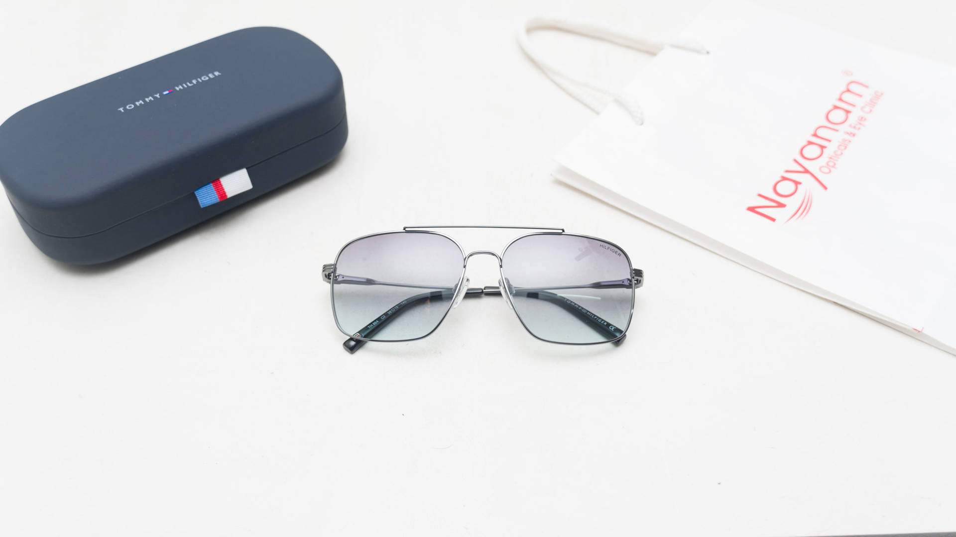 Tommy Hilfiger Blue Lens Rectangular Background