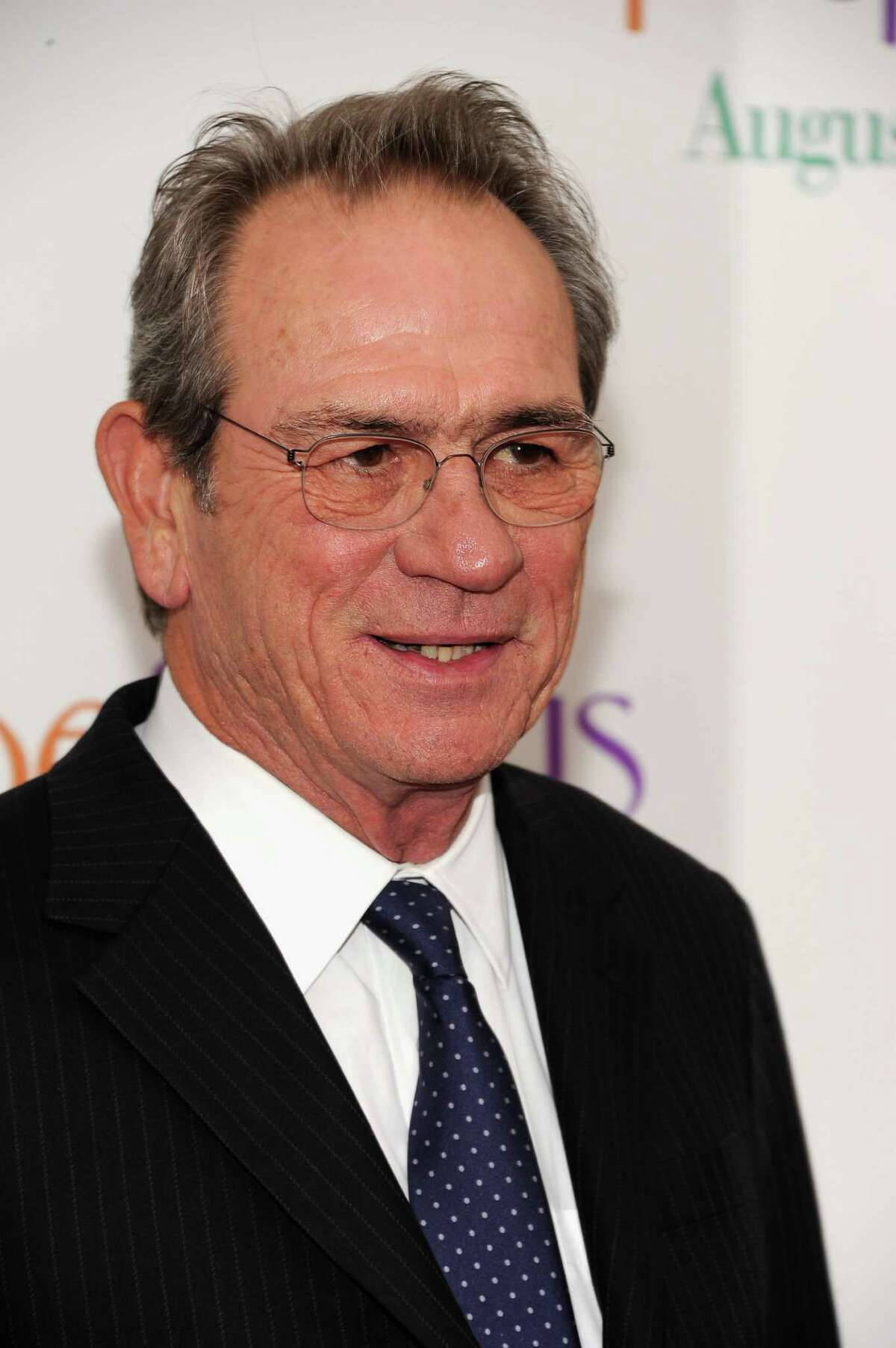 Tommy Lee Jones In Striped Coat And Polka Dot Necktie Background