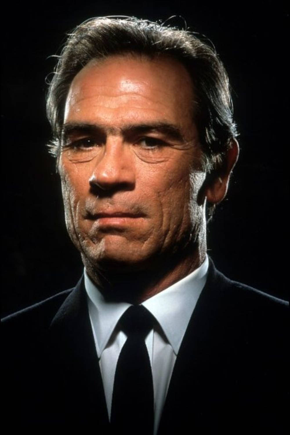 Tommy Lee Jones On A Dark Background Background