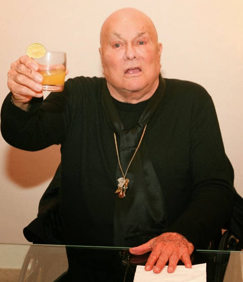 Tony Curtis Holding Glass Background