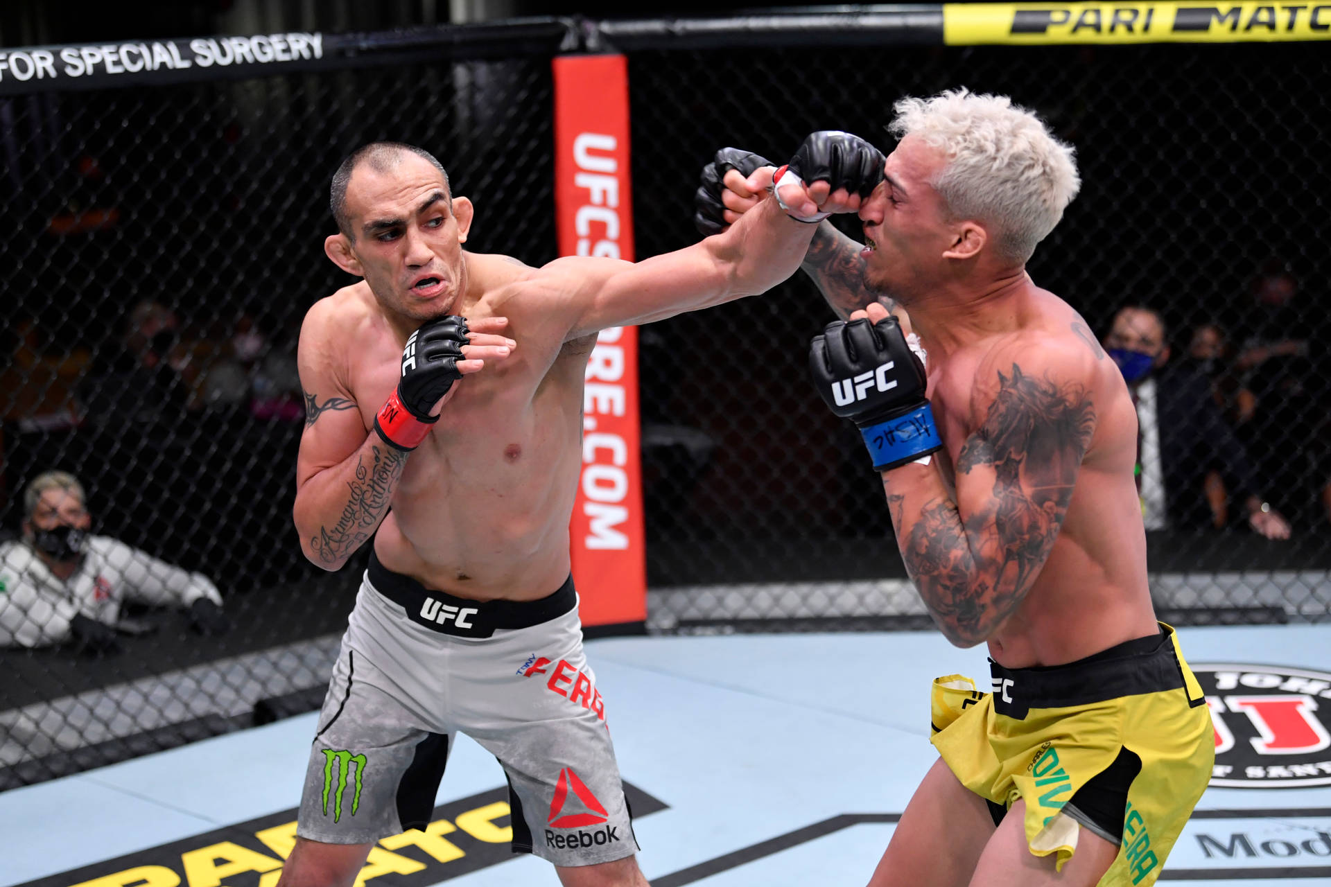 Tony Ferguson Exhibiting A Vigorous Punch Against Oliveira.