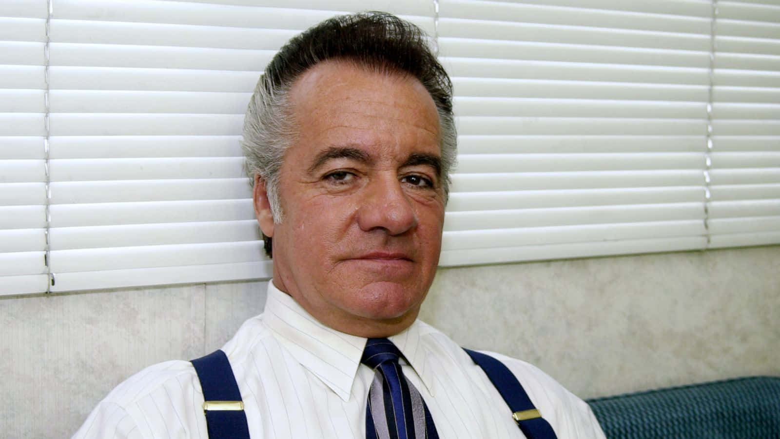 Tony Sirico, A Legendary Actor From The Sopranos, With A Compelling Gaze. Background