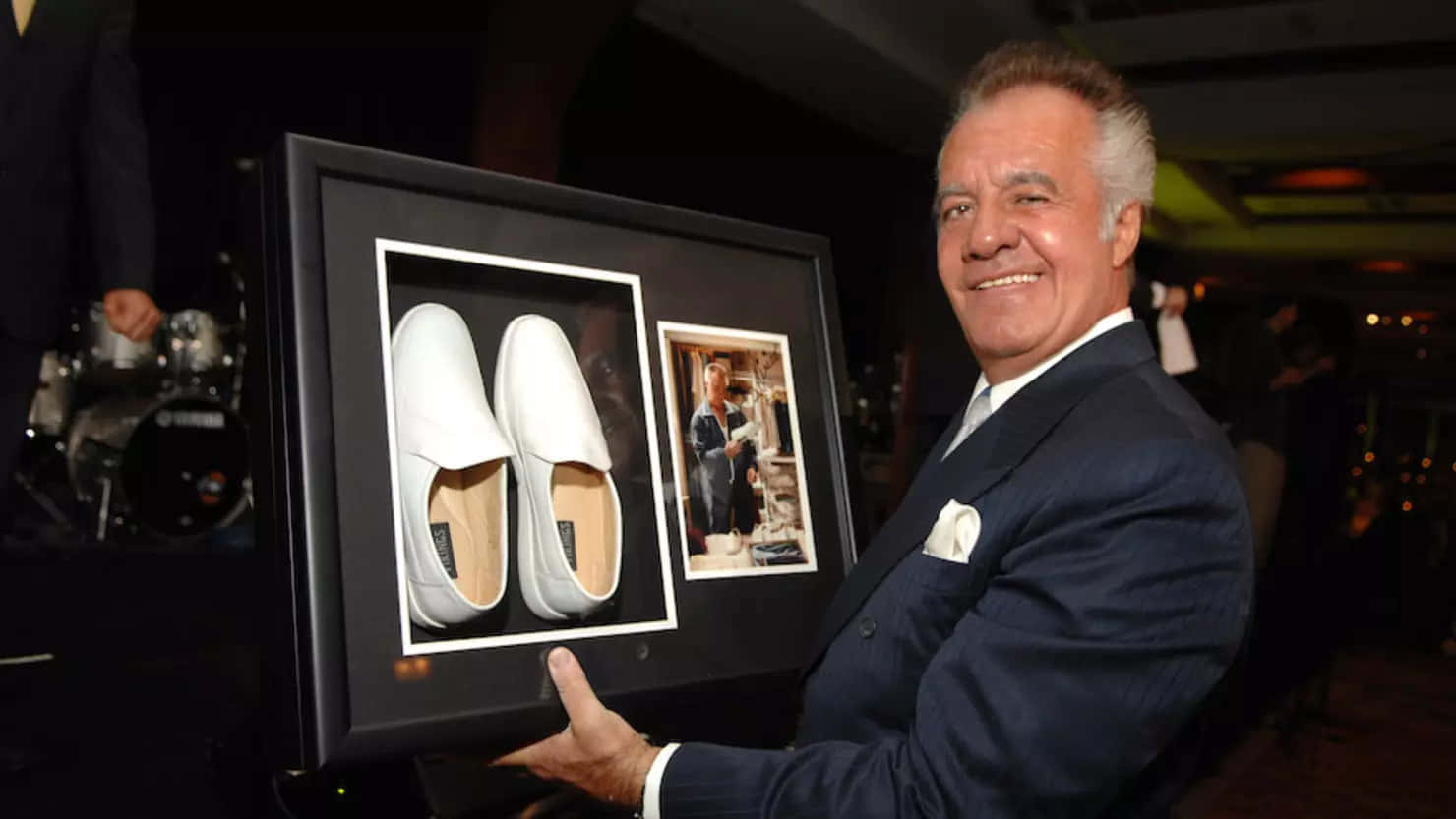 Tony Sirico Exuding Confidence In A Stylish Suit Background