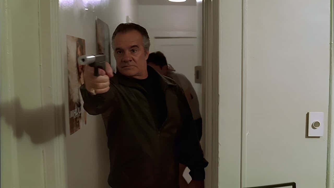 Tony Sirico Posing Confidently At A Public Event Background