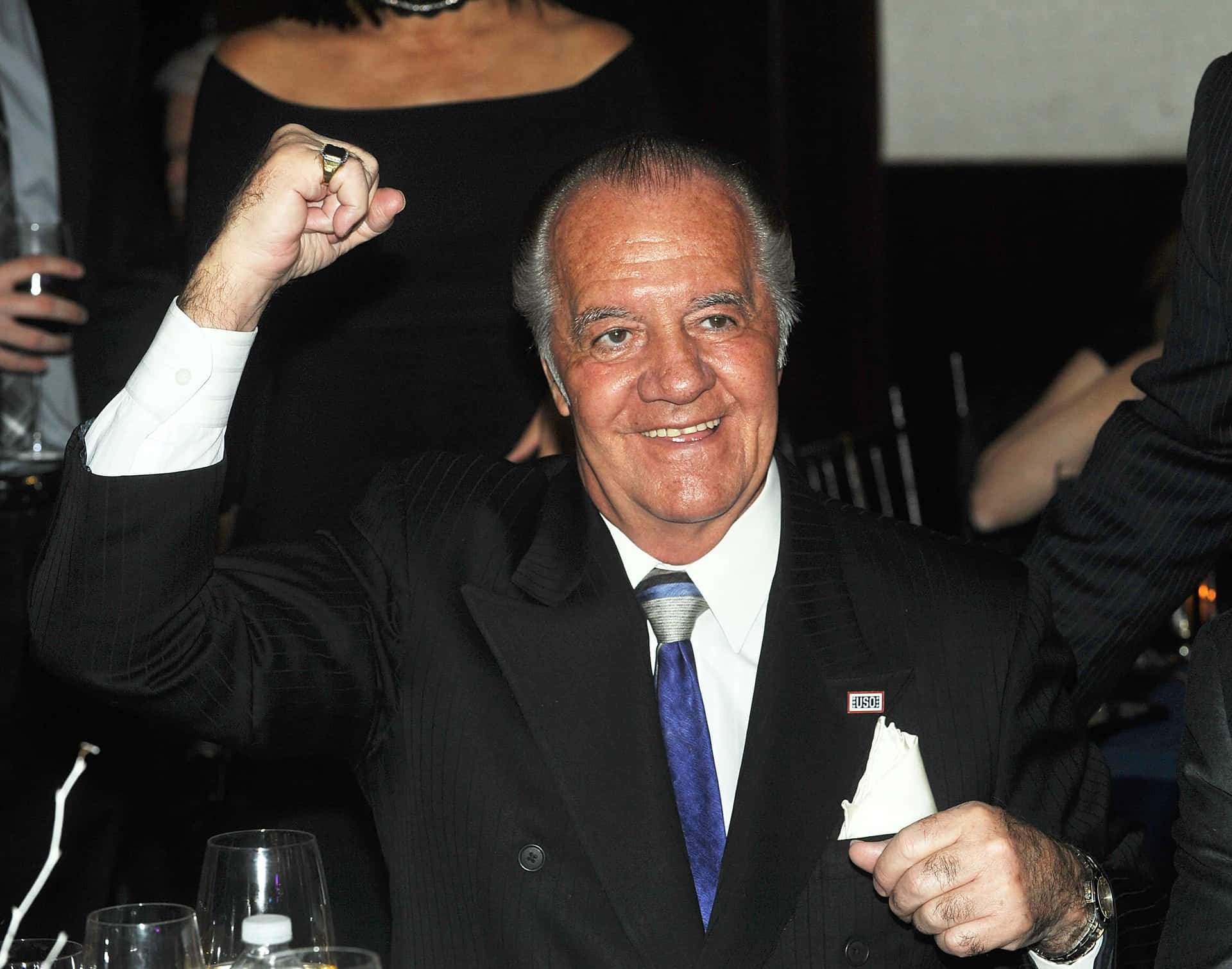 Tony Sirico Posing In A Classic Suit Background