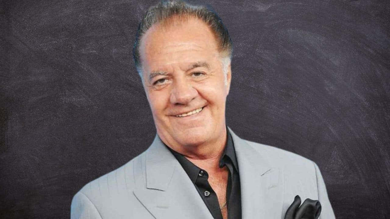 Tony Sirico Striking A Pose In A Classy Suit. Background