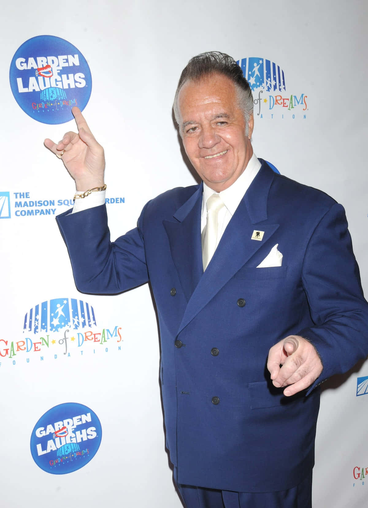 Tony Sirico Striking A Pose In A Sharp Suit Background