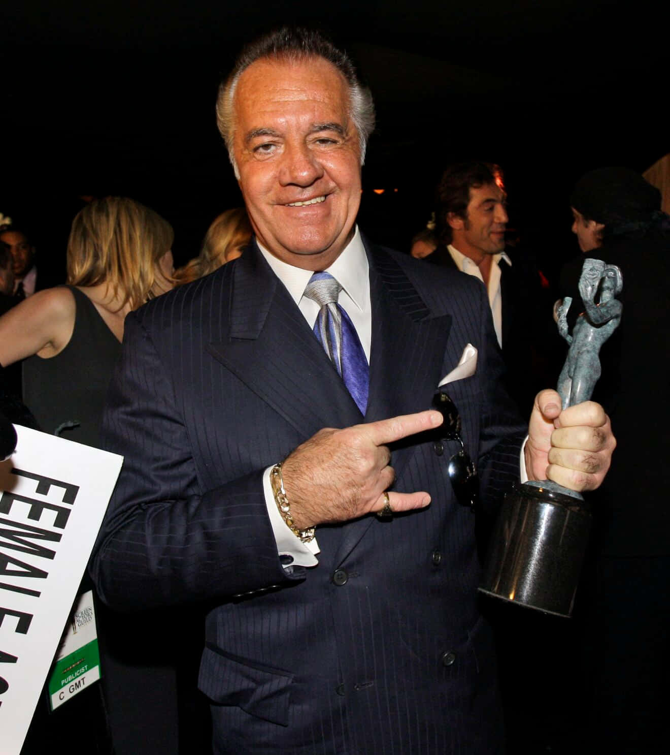 Tony Sirico Striking A Pose In A Suit Background