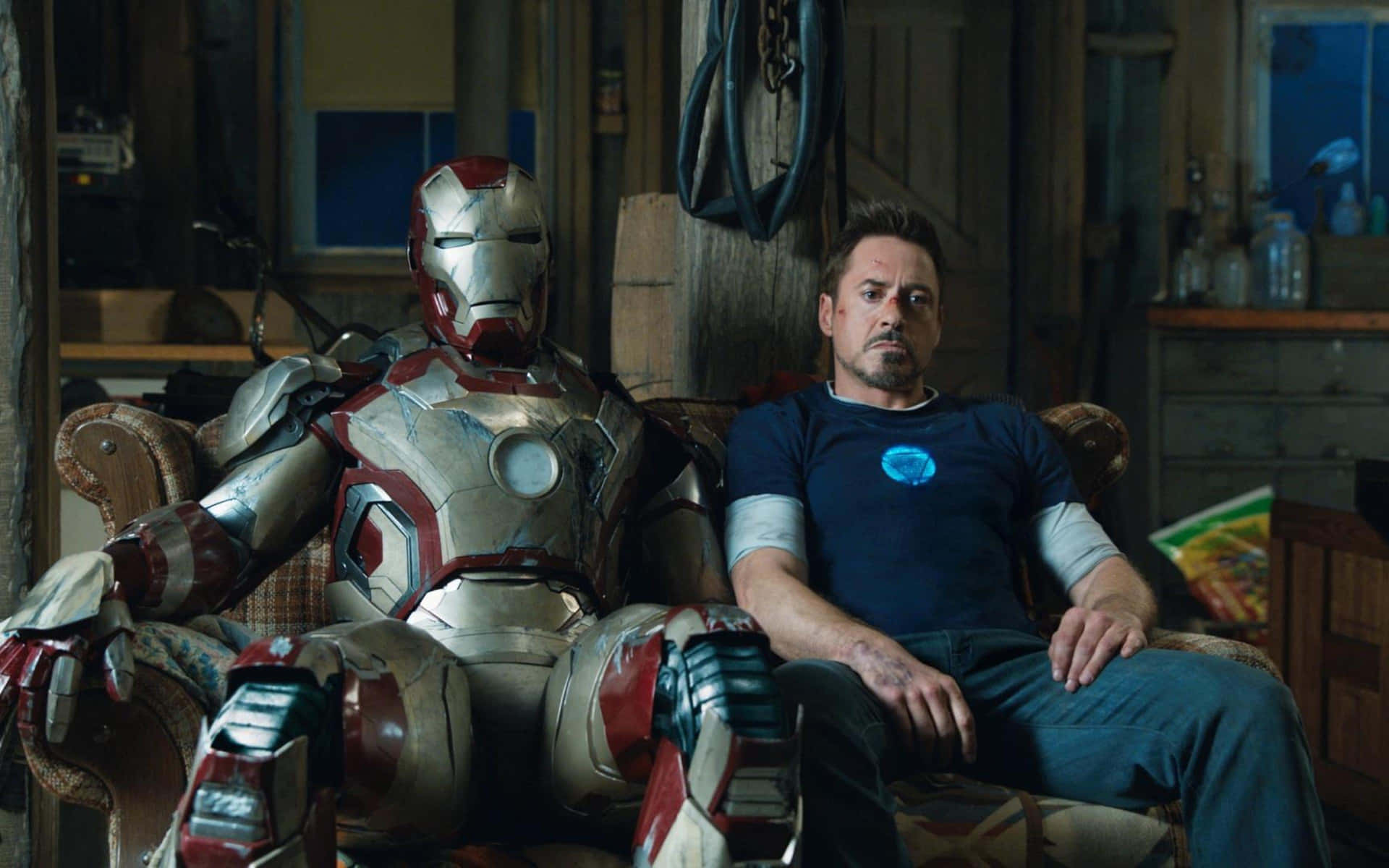 Tony Starkand Iron Man Suit Relaxing