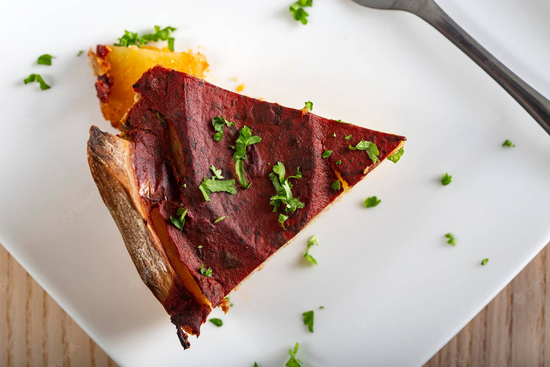 Top-view Of A Triangular Slice Of A Moussaka Background